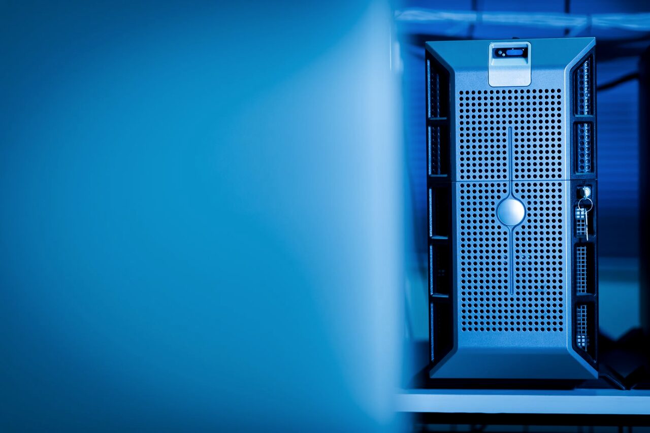 A single server unit lit blue inside a cloud data centre.