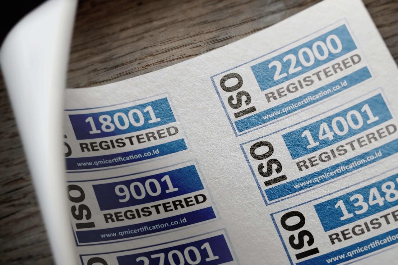 A sheet of ISO 9001, 14001 and 27001 registration marks.